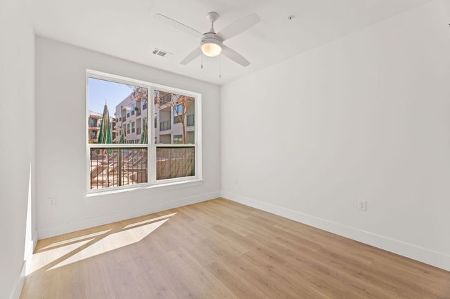 Secondary bedroom is filled with natural light | Image 16