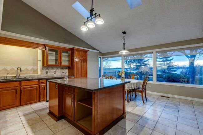 305 East Chestermere Drive, Home with 4 bedrooms, 2 bathrooms and 6 parking in Chestermere AB | Image 9