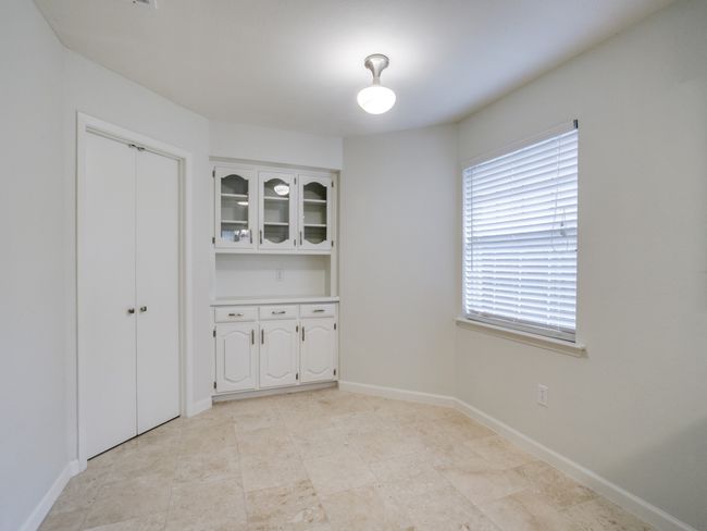 Unfurnished dining area with baseboards | Image 8