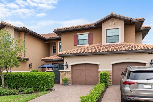 View of front of property featuring stucco siding, a tiled roof, and stone siding | Image 29