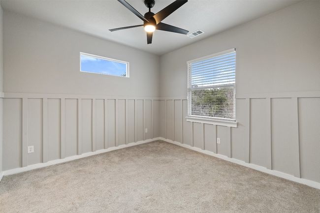 Carpeted bedroom 3 with ceiling fan, blinds, Board and batten style walls | Image 28