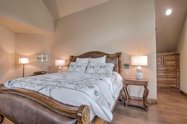 Step into the primary bedroom, with 2 bathrooms, 2 closets, and a sitting area. Enjoy a good book by the beautiful statement fireplace. | Image 17