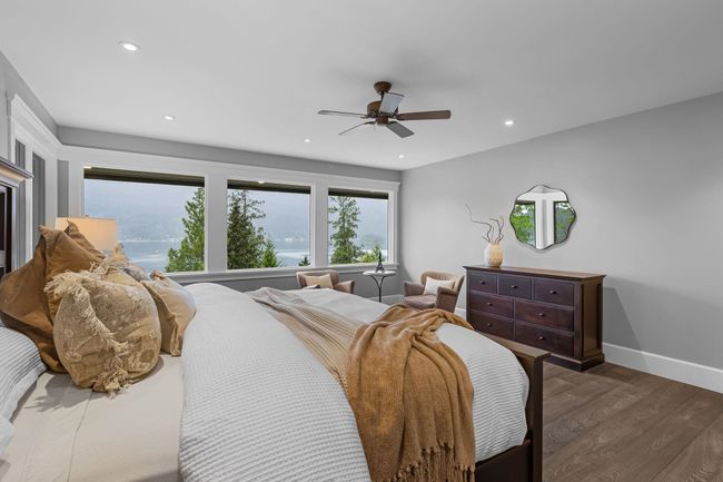 Bedroom featuring dark wood finished floors, recessed lighting, baseboards, and ceiling fan | Image 19