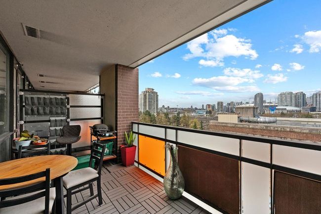 Balcony featuring a grill, a view of city, and visible vents | Image 23