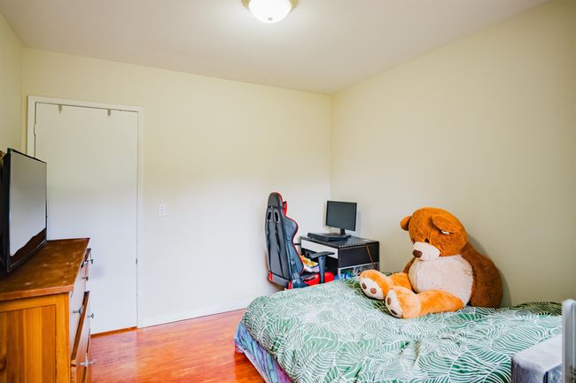 Bedroom featuring baseboards and light wood-style flooring | Image 17