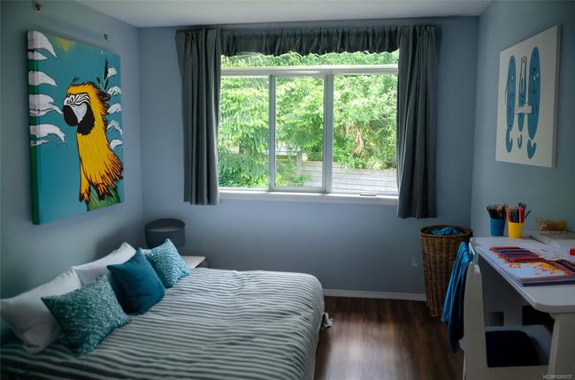 Home office with healthy amount of natural light, baseboards, and wood finished floors.Virtual Staging | Image 24