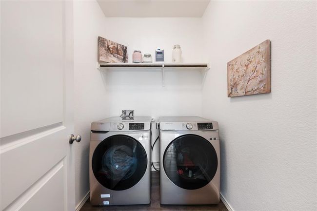 Laundry area featuring independent washer and dryer and baseboards | Image 29