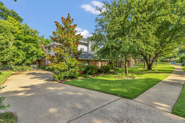 Obstructed view of property with brick siding and concrete driveway | Image 34