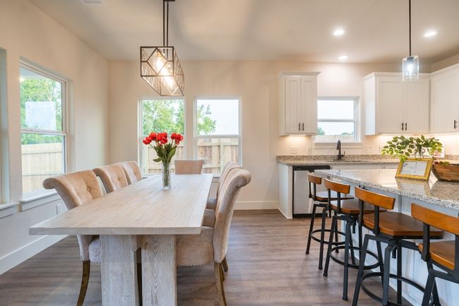 Dining room with dark wood-style floors, recessed lighting, and baseboards | Image 10