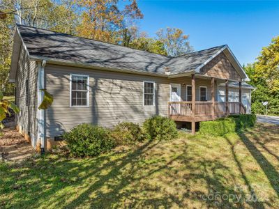 Located on a sloped lot above the road, this home escaped any risk of rising waters from Helene. | Image 3