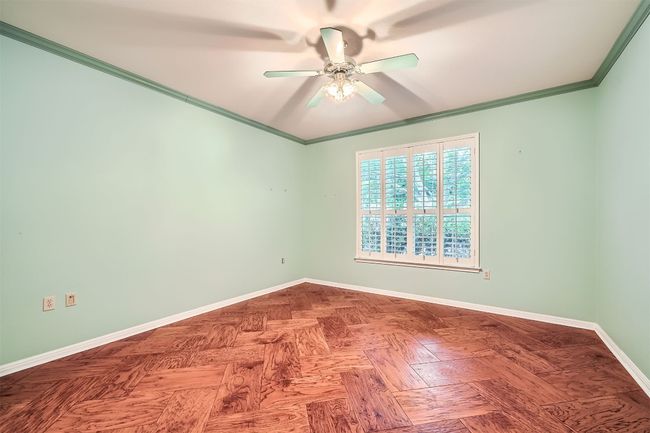 Spare room with ceiling fan, baseboards, and ornamental molding | Image 19