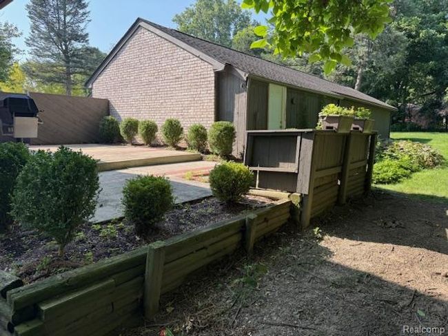 View of property exterior with brick siding | Image 32
