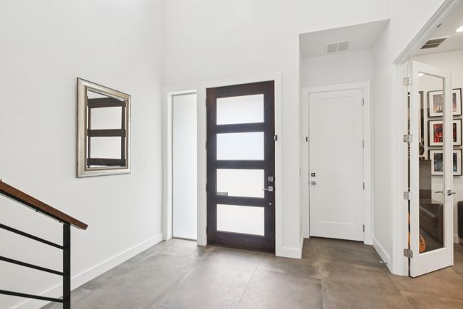 Foyer featuring baseboards and concrete floors | Image 4