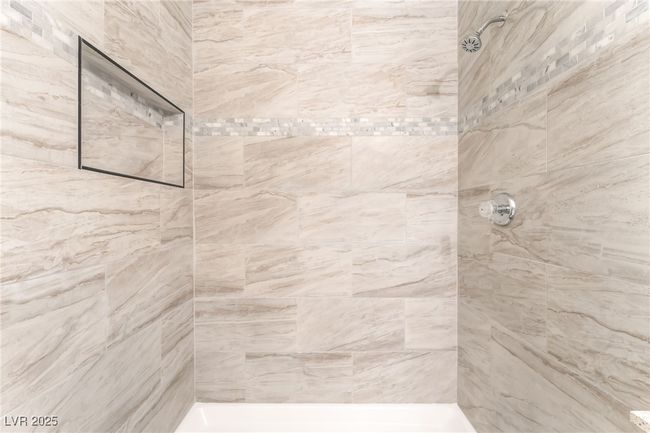 Bathroom featuring a tile shower | Image 25