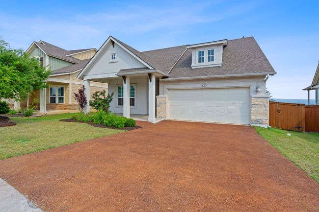Welcome to this classic craftsman with a pillared front porch, manicured landscaping, pervious driveway, and a two-car garage. | Image 8