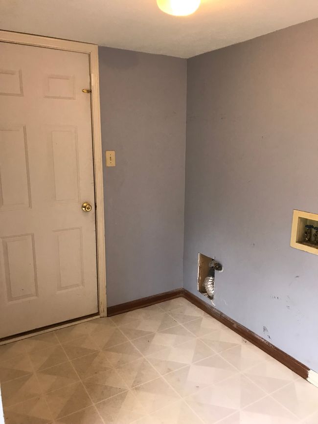 Laundry room with door to the garage | Image 23