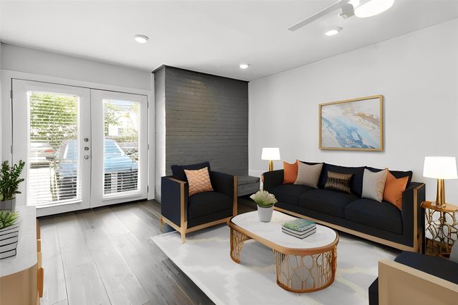 VIRTUALLY STAGED Living area with french doors, wood finished floors, and recessed lighting | Image 4
