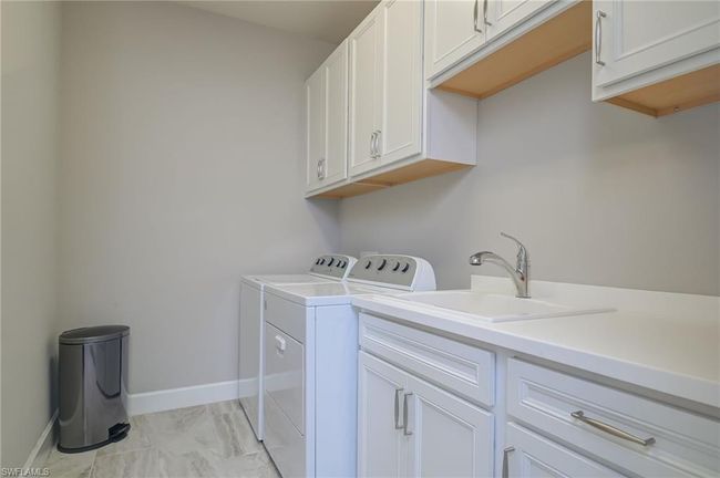 Finished laundry with utility sink | Image 23