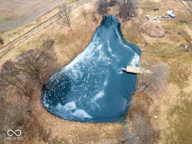 Pond is stocked with a dock. | Image 78