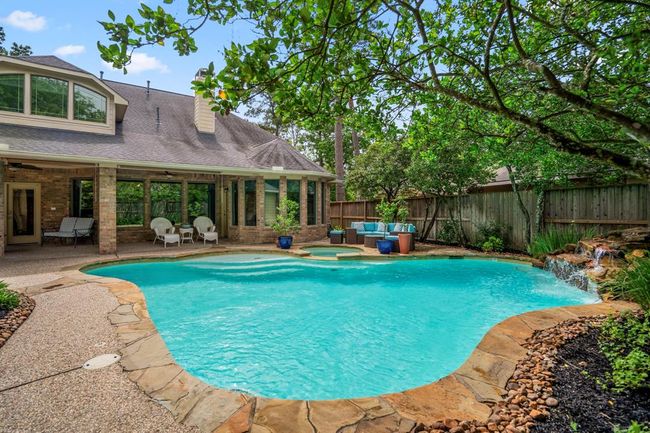 A view of the back of the home, which offers lots of outdoor entertainment without being overwhelmed with gardening as everything is done for you here. | Image 38