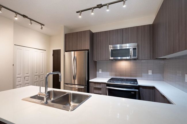 102 - 1152 Windsor Mews, Condo with 3 bedrooms, 2 bathrooms and 2 parking in Coquitlam BC | Image 19