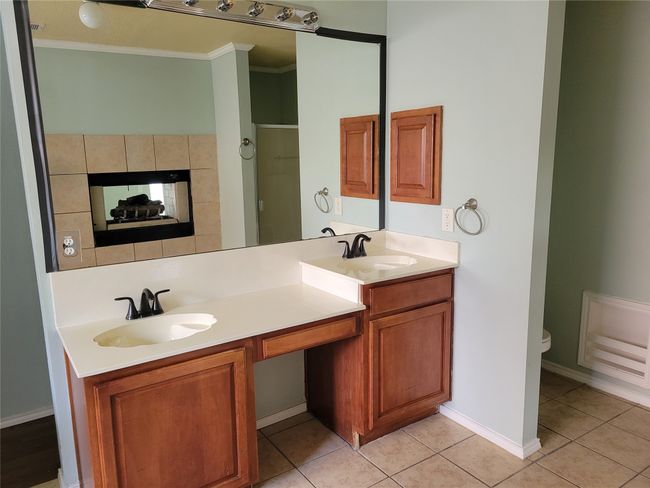 Full bath with crown molding, double vanity, and tile patterned floors | Image 14