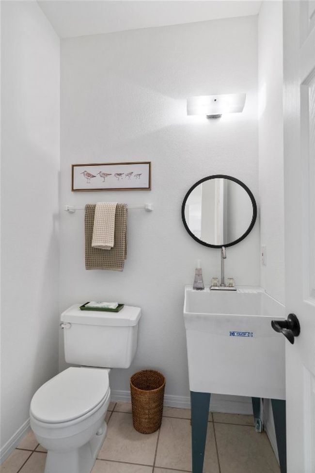 Bathroom with tile patterned floors, baseboards, and toilet | Image 14