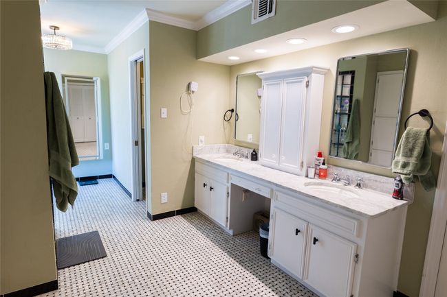 Bathroom featuring vanity and crown molding | Image 29