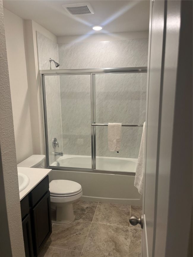 Full bath featuring vanity and shower / bath combination with glass door | Image 9