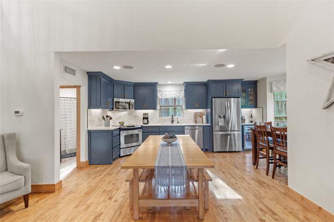 Kitchen Features Freshly Painted Cabinets with Lovely Hardware, New Quartz Countertops and Modern Tile Backsplash! | Image 10