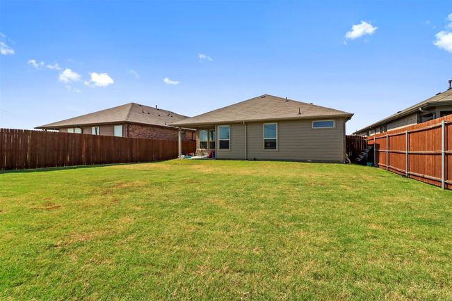 Back of house featuring a fenced​​‌​​​​‌​​‌‌​‌‌​​​‌‌​​‌‌​‌​​​​​‌ backyard | Image 15