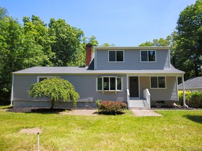 Front of property with a front lawn set back from the road. | Image 1