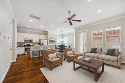 Experience seamless living with a modern open-concept design, combining the kitchen, dining, and living areas on the first floor – perfect for entertaining and everyday comfort. (virtually staged) | Image 3