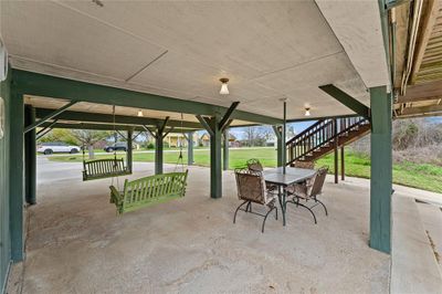 Whether it's a warm summer day or a cool evening, this covered space offers shelter from the elements, allowing you to enjoy the outdoors year-round. Rain or shine, your canal-side gatherings remain a delightful experience. | Image 3