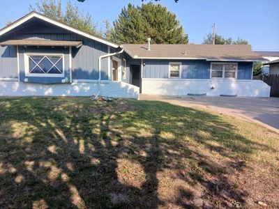 Ranch-style house with a front lawn | Image 1