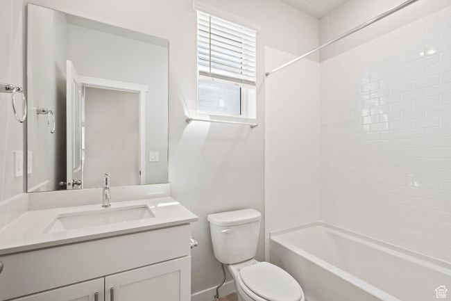 Full bath featuring vanity, bathing tub / shower combination, and toilet | Image 44
