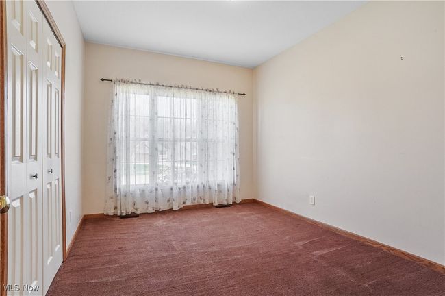 Carpeted empty room with baseboards | Image 34