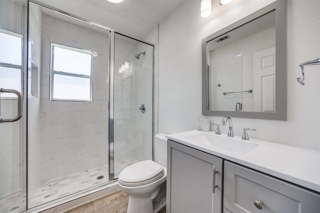 Bathroom with a shower stall, vanity | Image 17