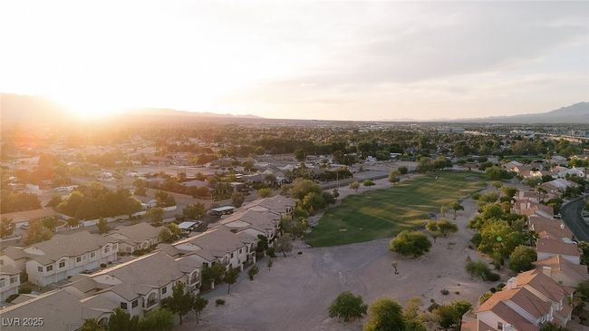 View of property location featuring nearby suburban area, a mountain backdrop, and a golf club | Image 47