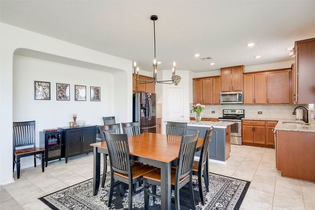 Dining room featuring light tile patterned floors and recessed lighting | Image 7
