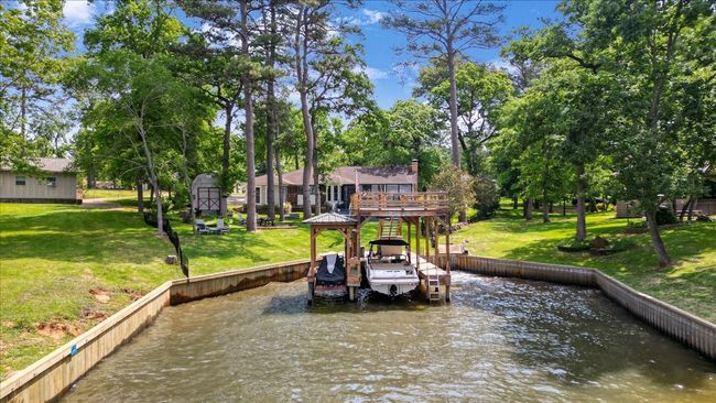 Dock area with a lawn and a deck with water view | Image 36