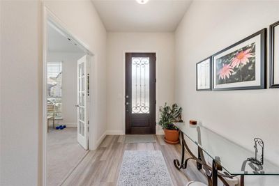 Entrance foyer featuring light laminate flooring and bonus room French door entry | Image 3