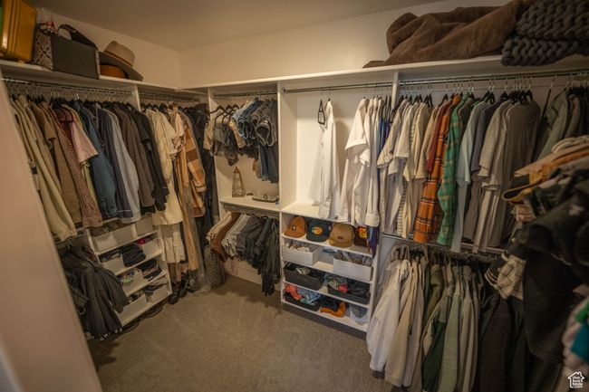 This large, custom-designed walk-in closet in the primary suite makes staying organized a breeze—with smart storage, plenty of space, and a layout that keeps everything neat and easy to access. | Image 19