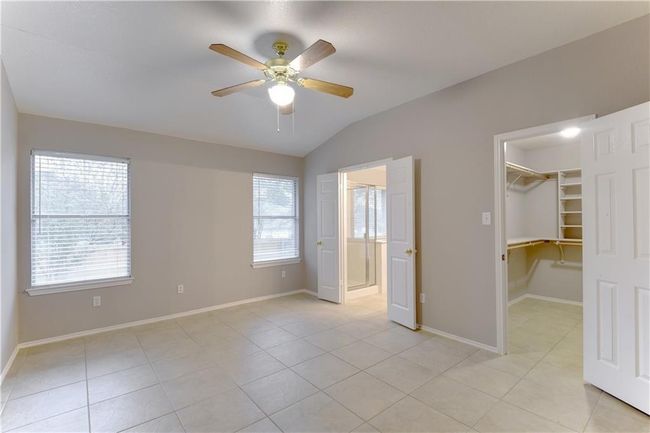 Spare room with plenty of natural light, light tile patterned floors, and a smoke detector | Image 13