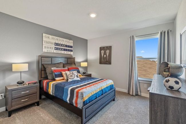 Secondary Bedroom featuring light - Level 2. Virtually staged. | Image 18