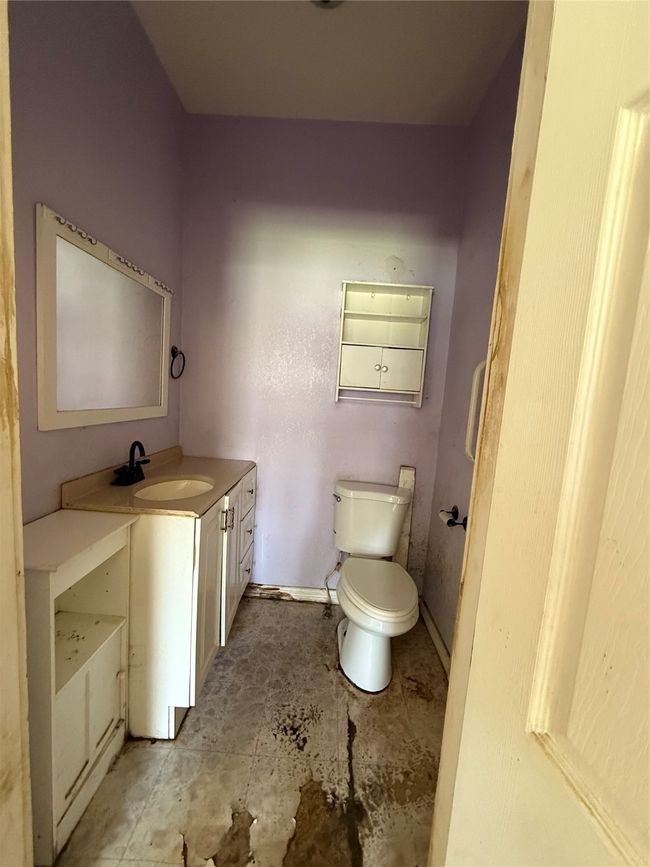 Half bathroom with vanity and toilet | Image 11