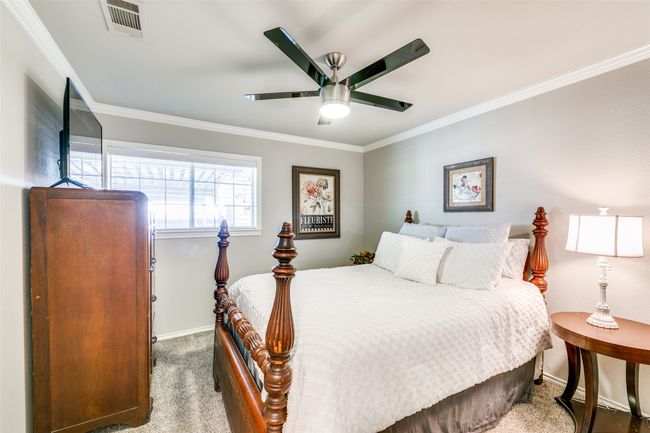Secondary bedroom currently used as a guest room. Note the crown molding | Image 15