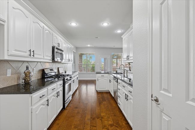 Kitchen with pantry and an abundance of cabinets | Image 13