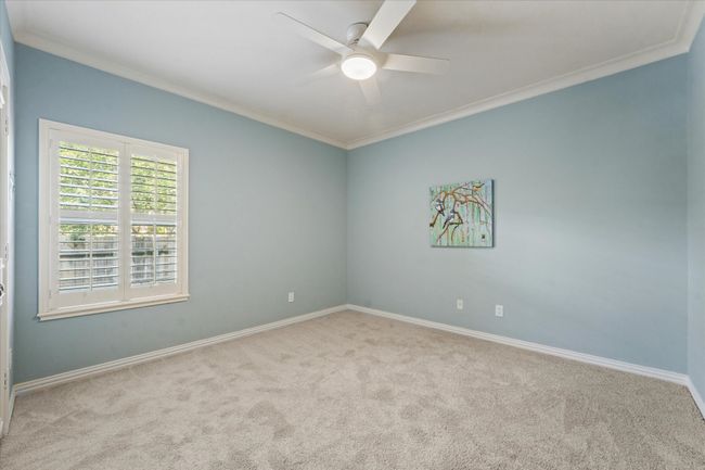 Second Bedroom featuring ornamental molding, a ceiling fan, and baseboards | Image 20