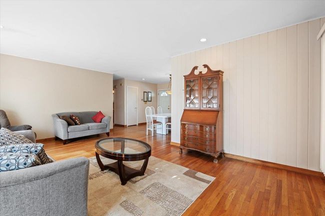 Living room with hardwood / wood-style floors | Image 5
